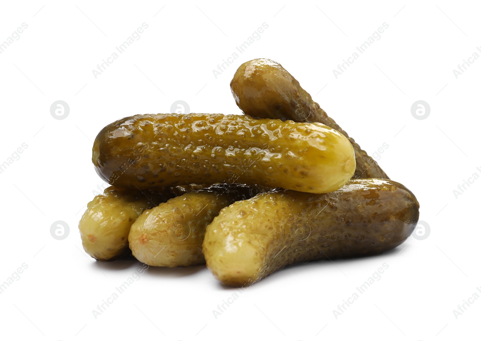 Photo of Pile of tasty pickled cucumbers isolated on white