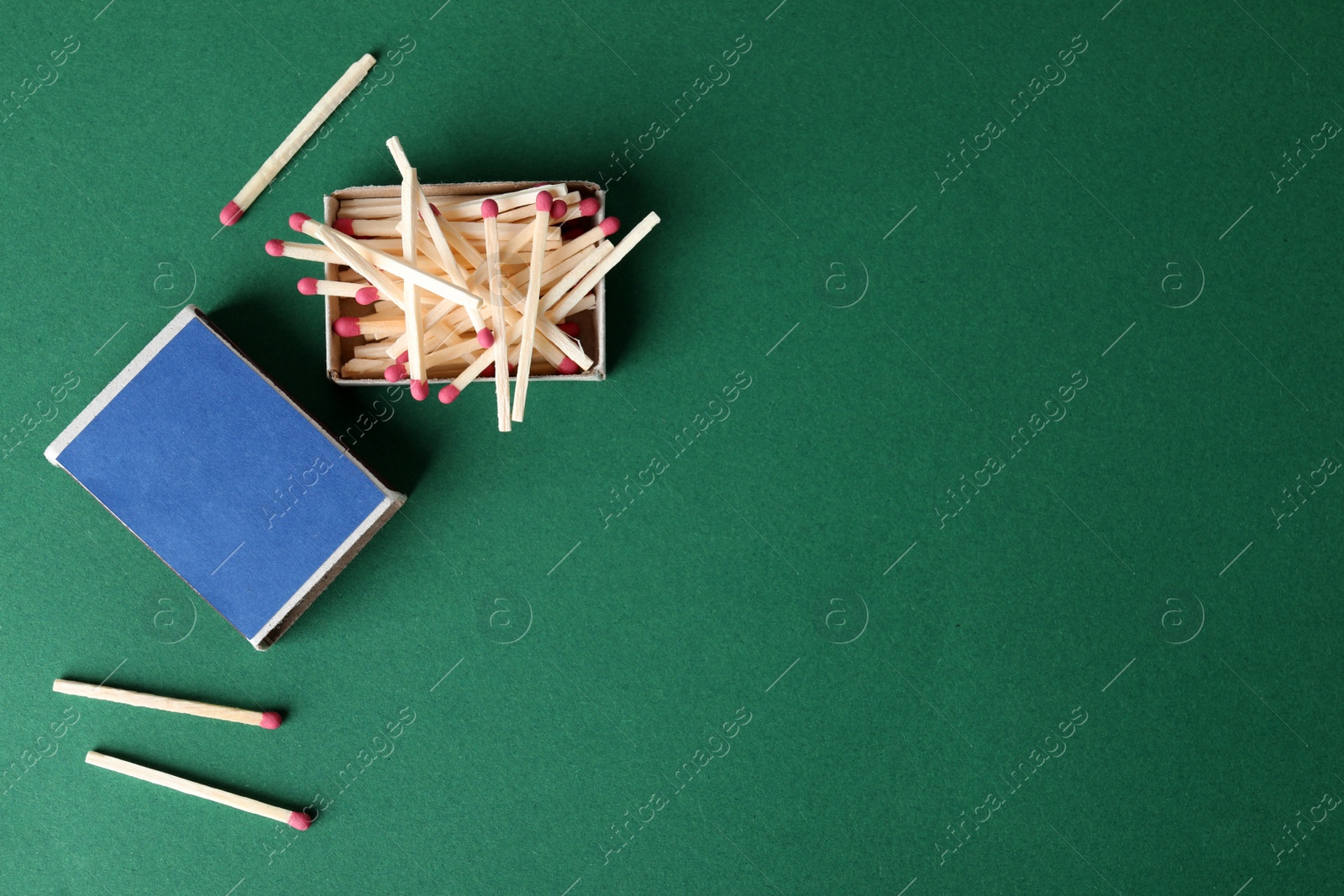 Photo of Flat lay composition with matches and space for text on color background