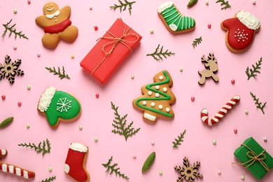 Flat lay composition with Christmas decorations on pink background