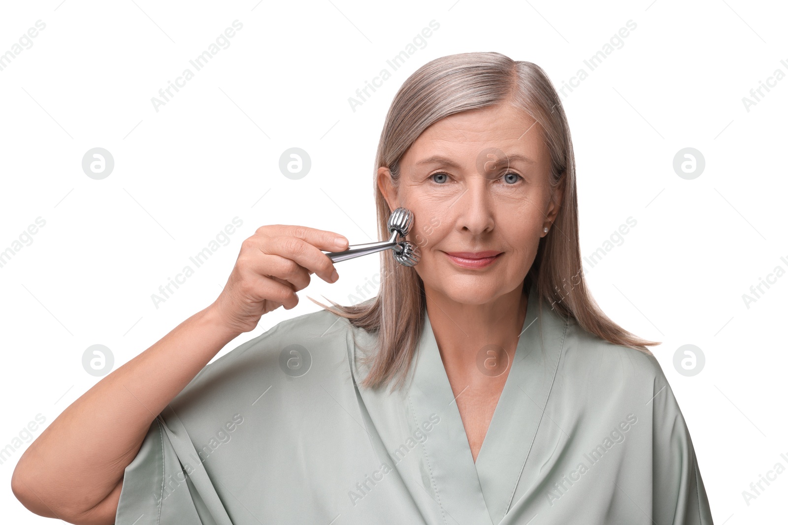 Photo of Woman massaging her face with metal roller isolated on white