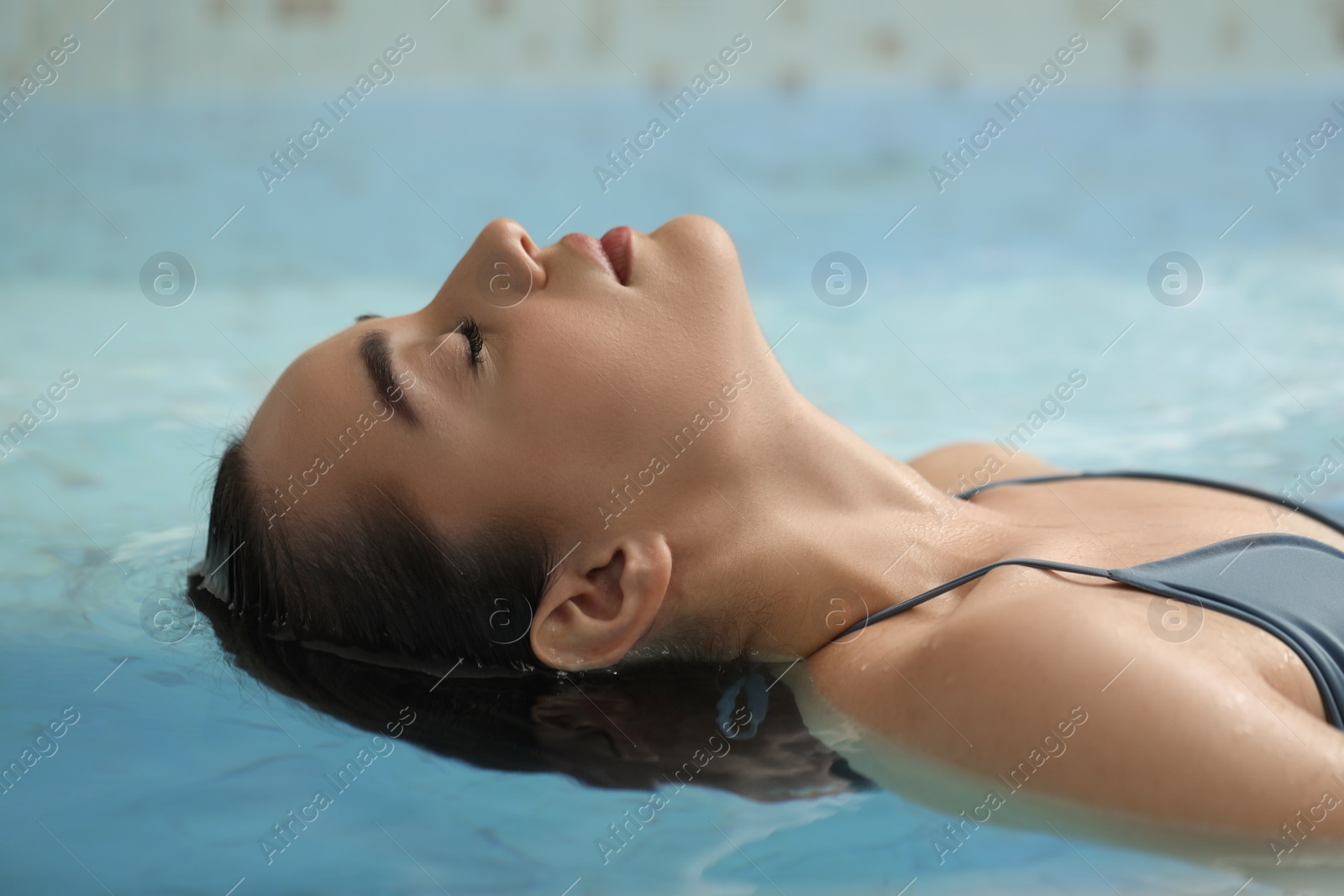 Photo of Beautiful woman relaxing in spa swimming pool