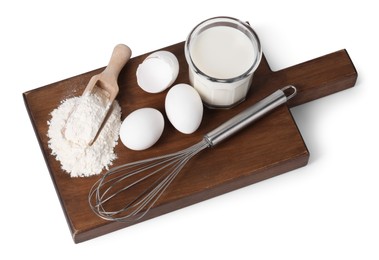 Photo of Board with metal whisk, raw eggs, flour, milk and scoop isolated on white, above view