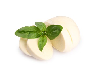 Slices of tasty mozzarella and basil leaves isolated on white