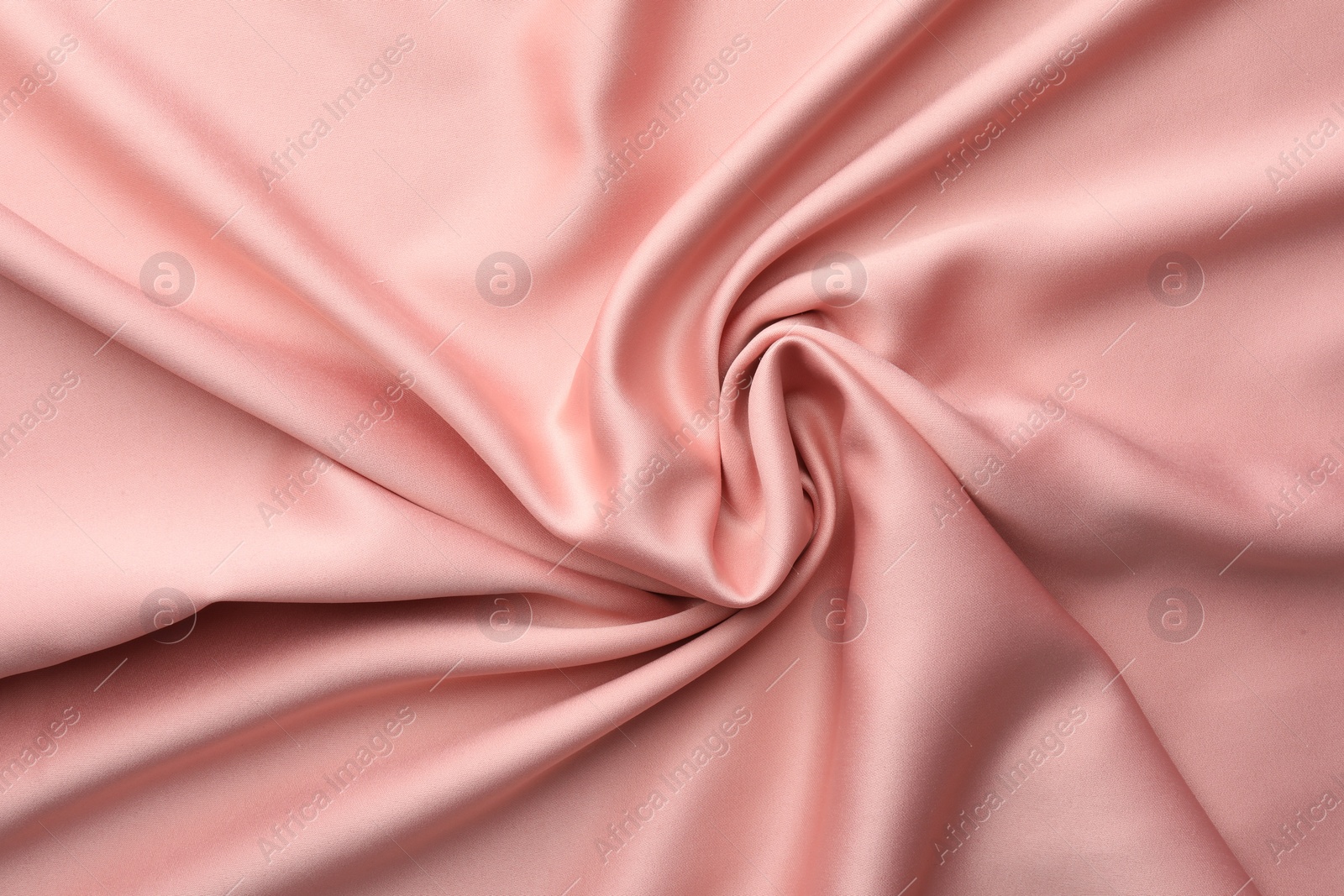 Photo of Crumpled pink silk fabric as background, top view