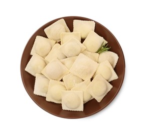 Photo of Uncooked ravioli and rosemary in bowl on white background, top view