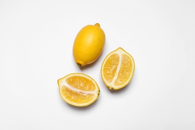 Photo of Many fresh ripe lemons on white background, top view