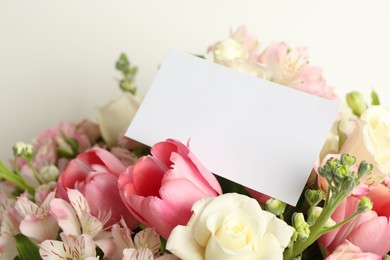 Photo of Happy Mother's Day. Beautiful flowers with blank card on light background, closeup