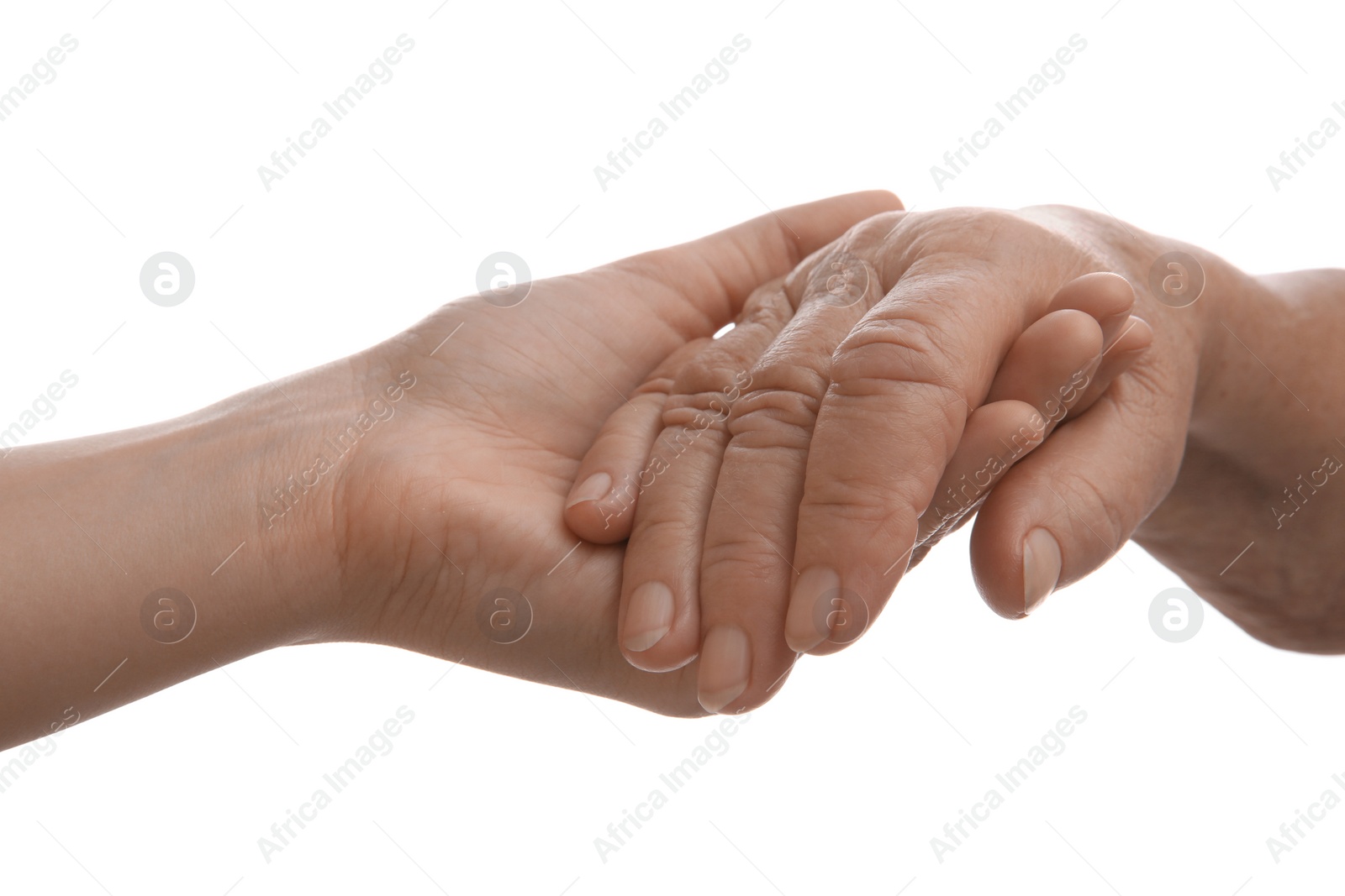 Photo of Young and elderly women holding hands together on white background, closeup