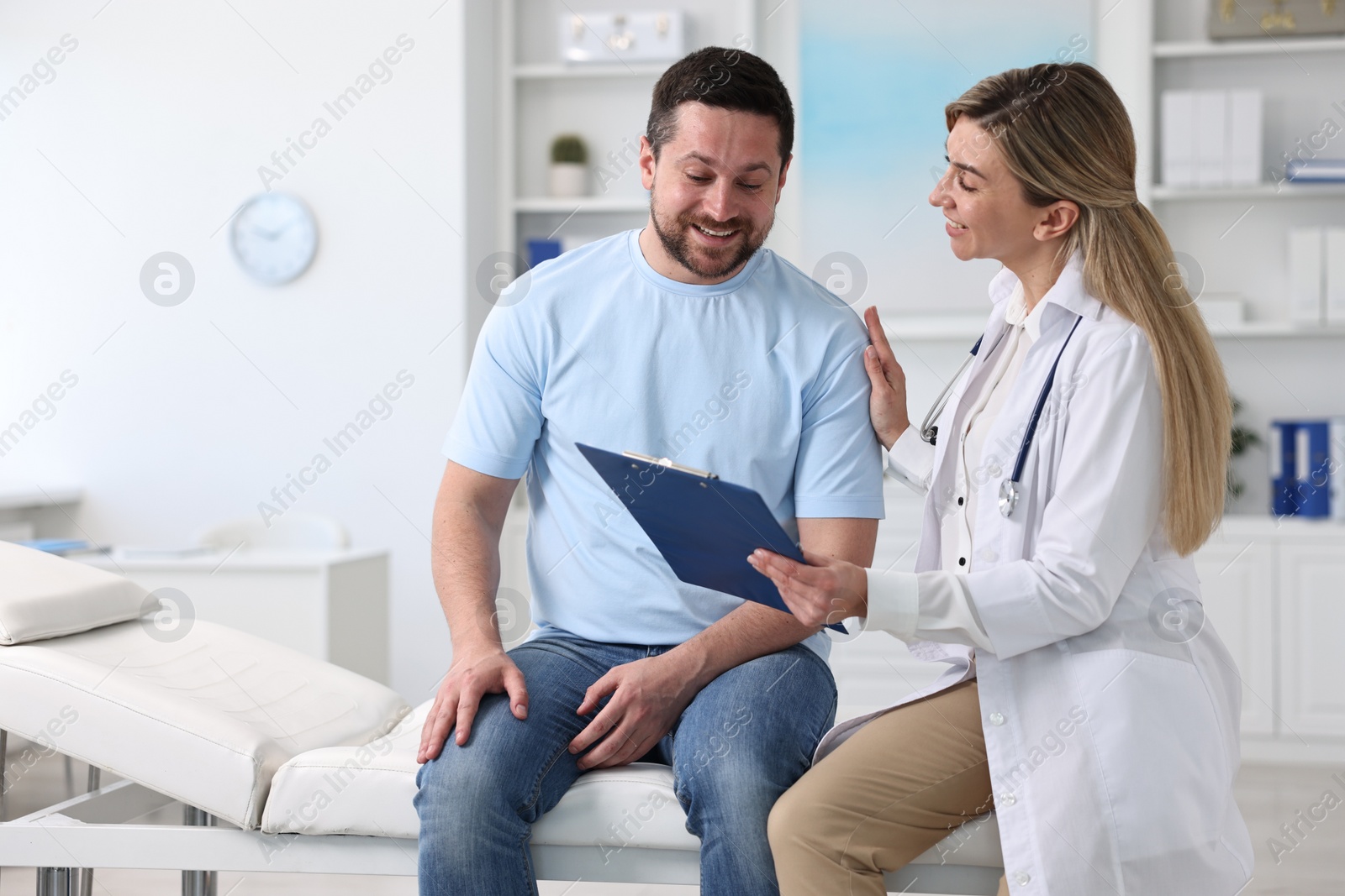 Photo of Professional doctor working with patient in hospital, space for text