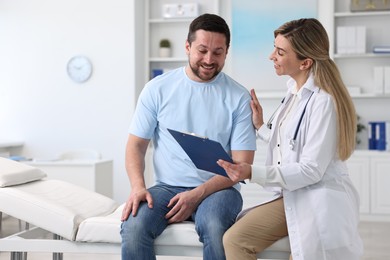 Professional doctor working with patient in hospital, space for text