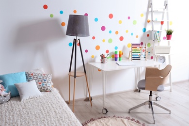 Modern child room interior with desk and bed