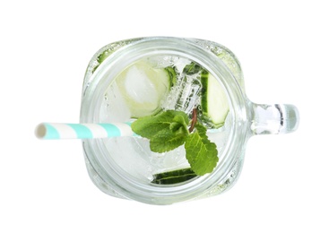 Photo of Mason jar with fresh cucumber water on white background, top view