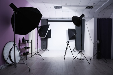 Photo of Interior of modern photo studio with professional equipment