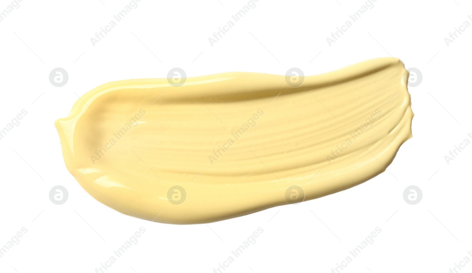 Photo of Stroke of yellow color correcting concealer isolated on white