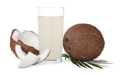 Photo of Glass of coconut water, leaf and nuts isolated on white