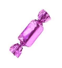 Tasty candy in violet wrapper isolated on white