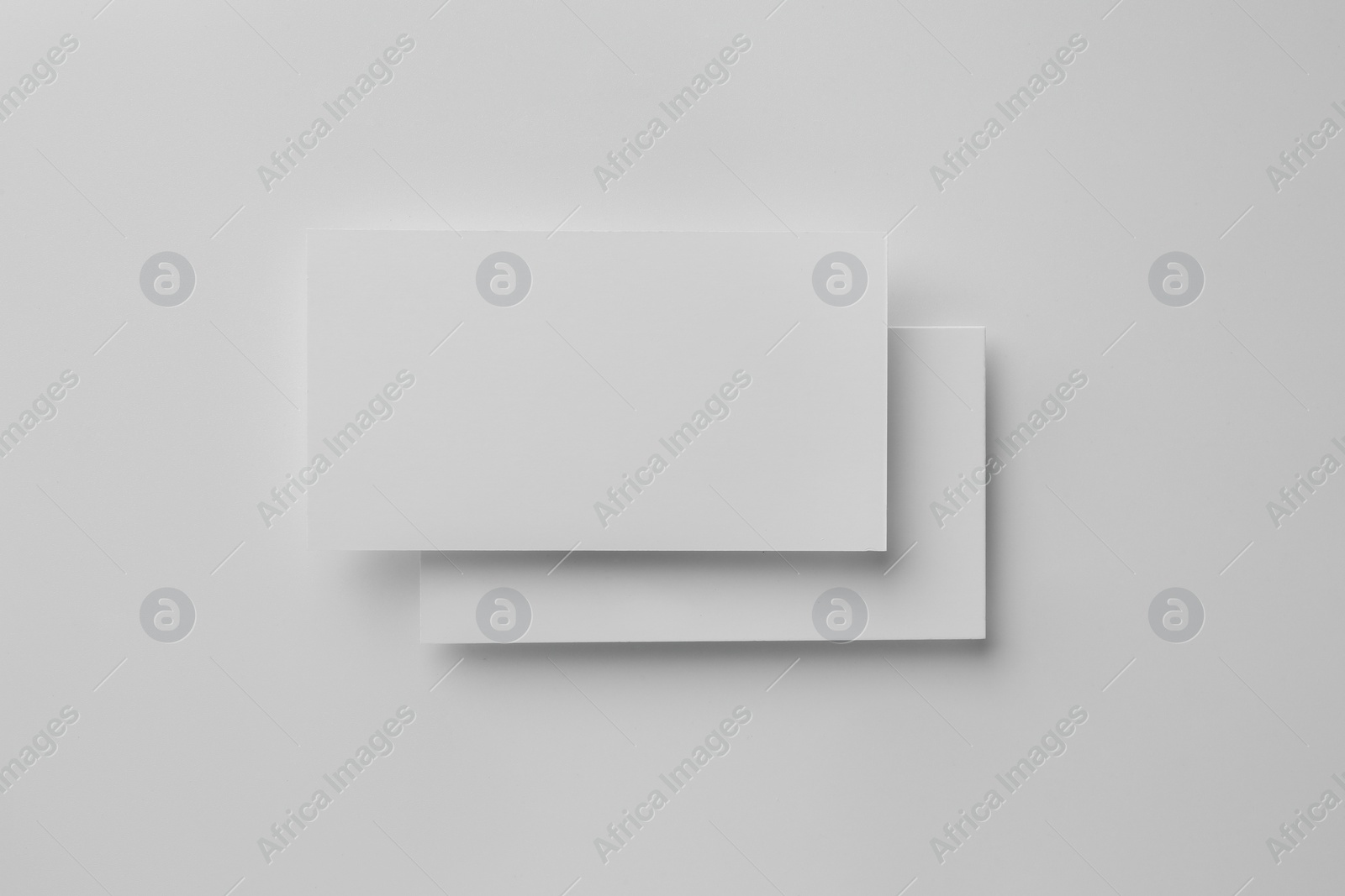 Photo of Blank business cards on white background, top view. Mockup for design