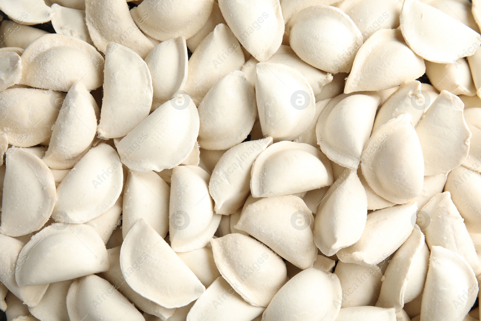 Photo of Raw dumplings as background, top view. Home cooking