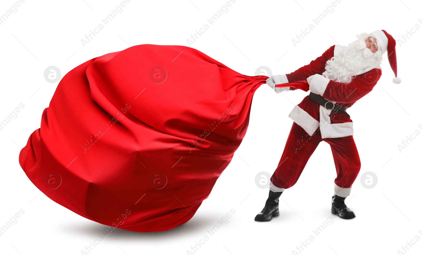 Image of Santa Claus pulling enormous red bag full of Christmas gifts on white background