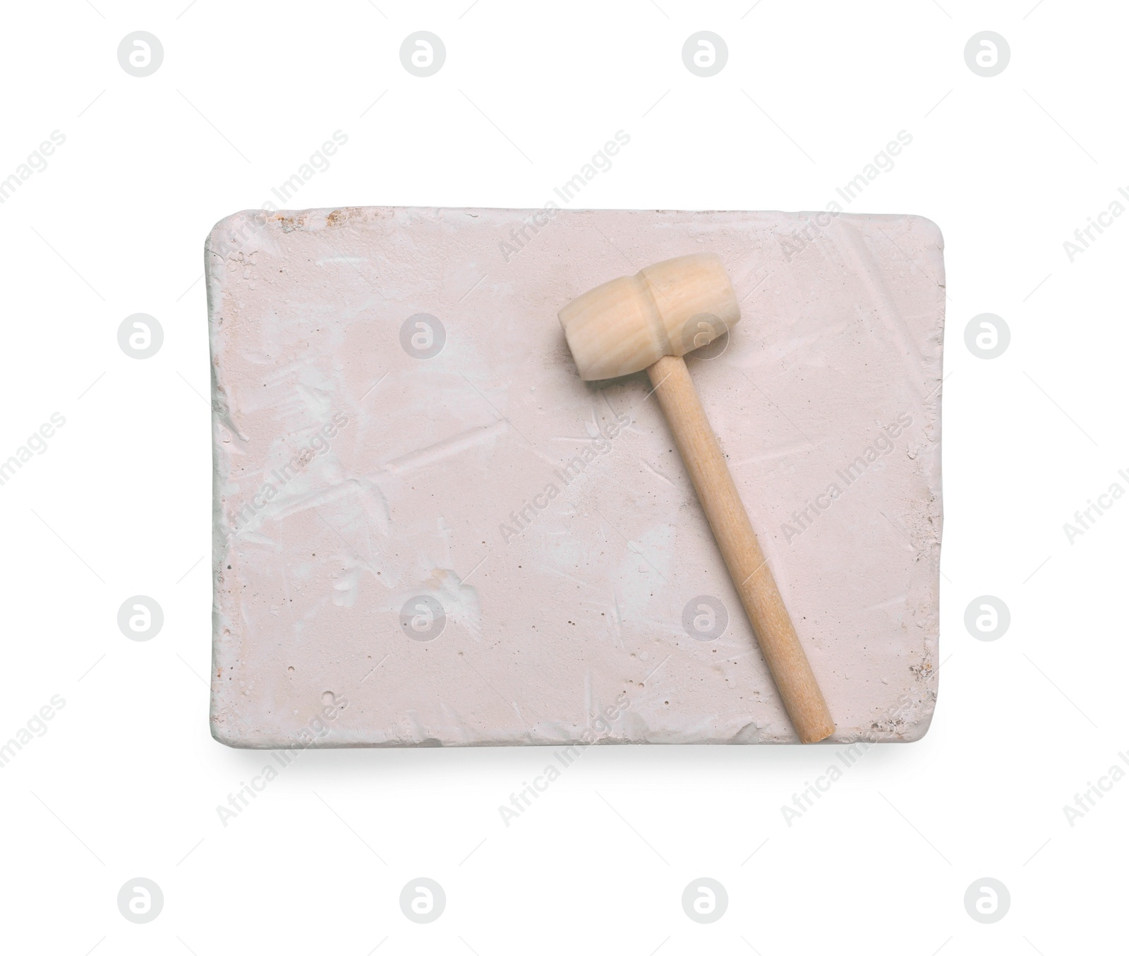 Photo of Educational toy for motor skills development. Excavation kit (plaster and wooden mallet) isolated on white, top view