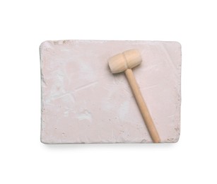 Photo of Educational toy for motor skills development. Excavation kit (plaster and wooden mallet) isolated on white, top view