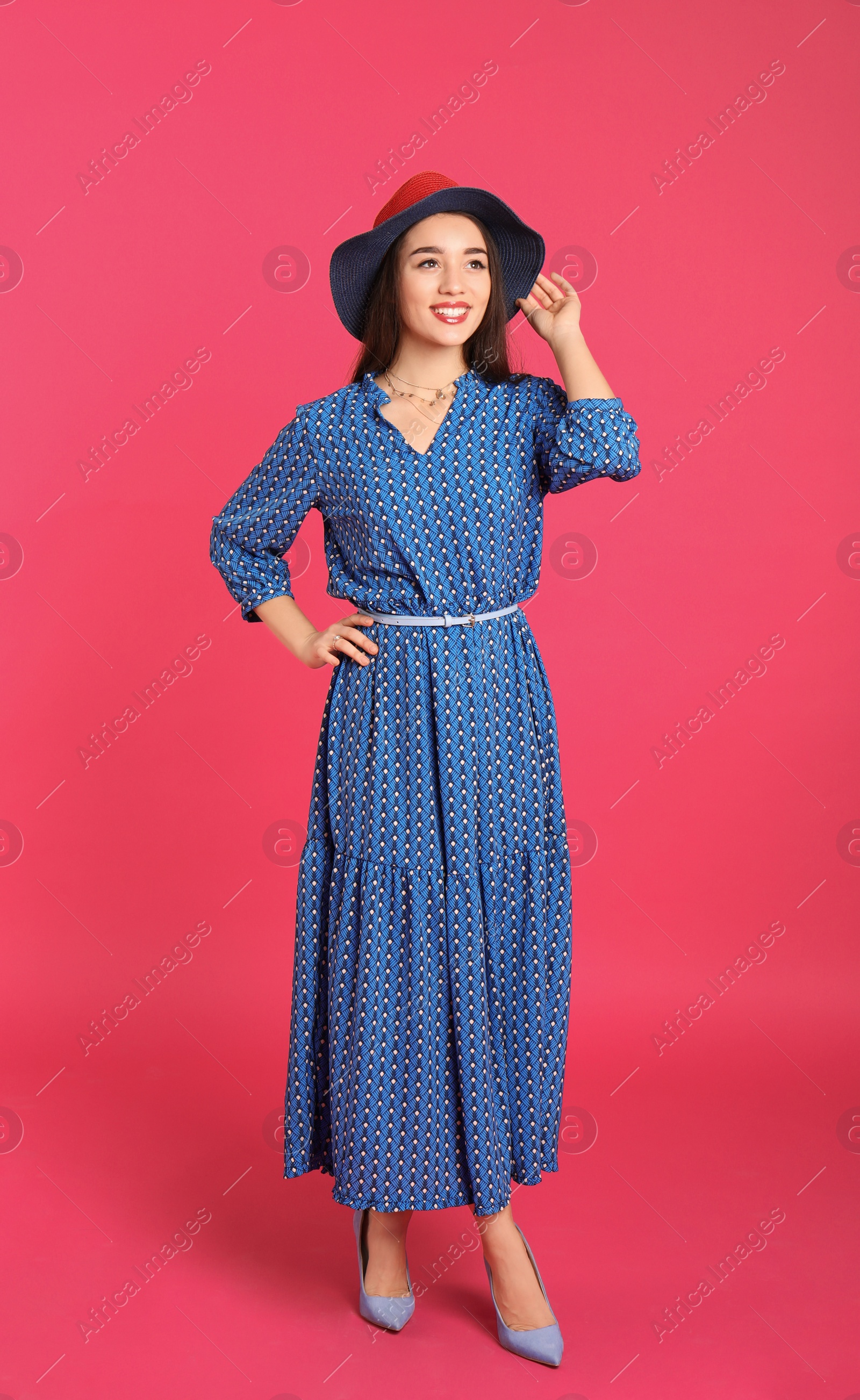 Photo of Portrait of beautiful young woman in stylish dress on color background