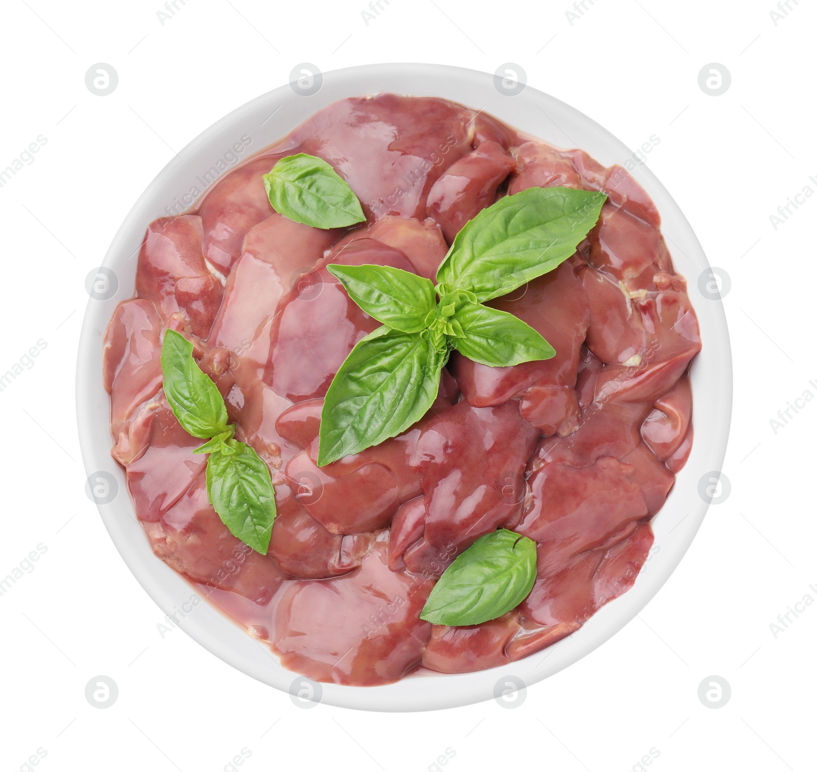Photo of Bowl with raw chicken liver and basil isolated on white, top view
