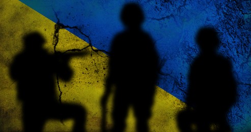 Silhouettes of soldiers with Ukrainian flag colors on background. Military service during war