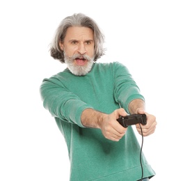 Emotional mature man playing video games with controller isolated on white