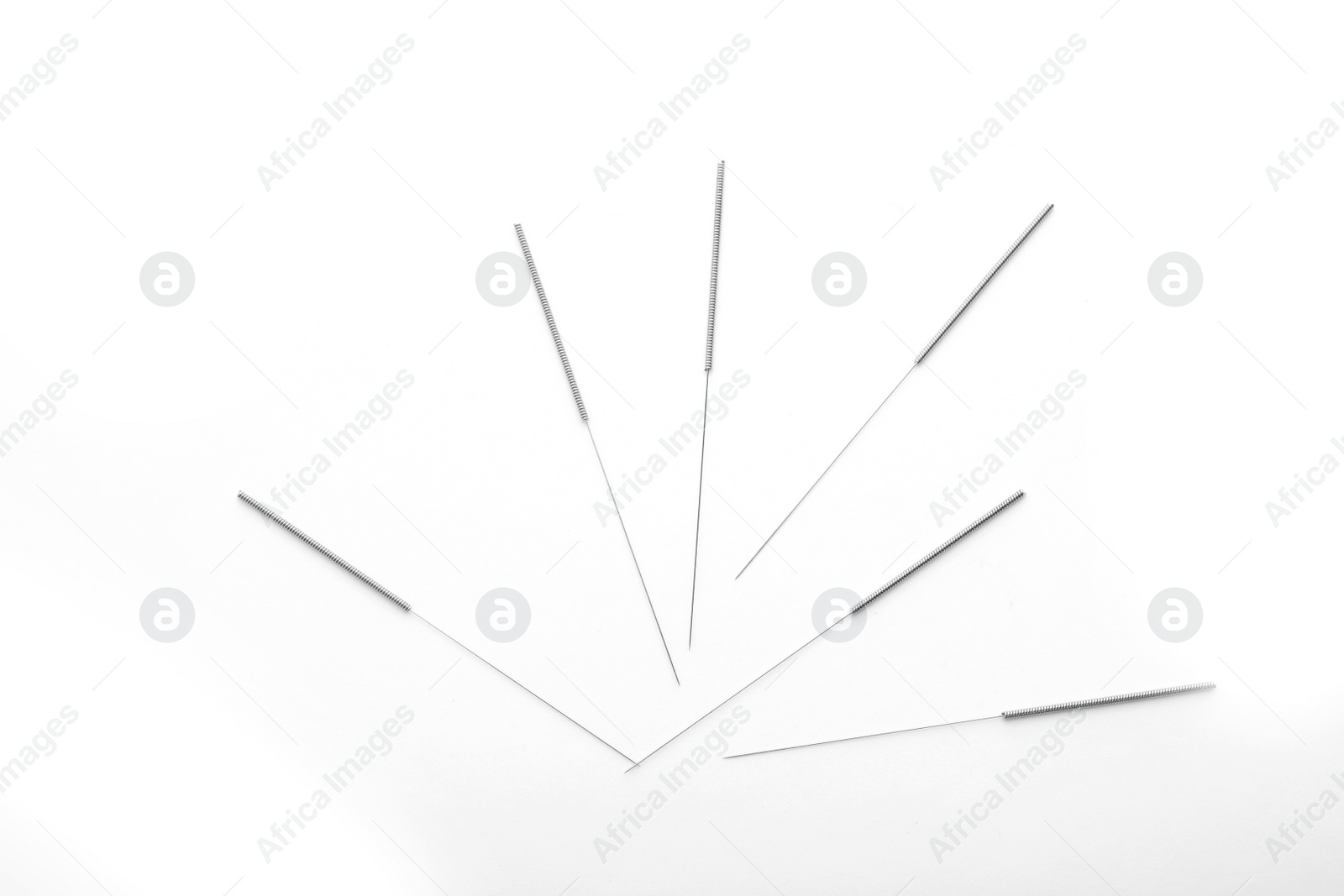 Photo of Needles for acupuncture on white background