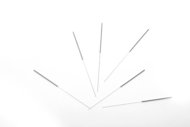 Photo of Needles for acupuncture on white background