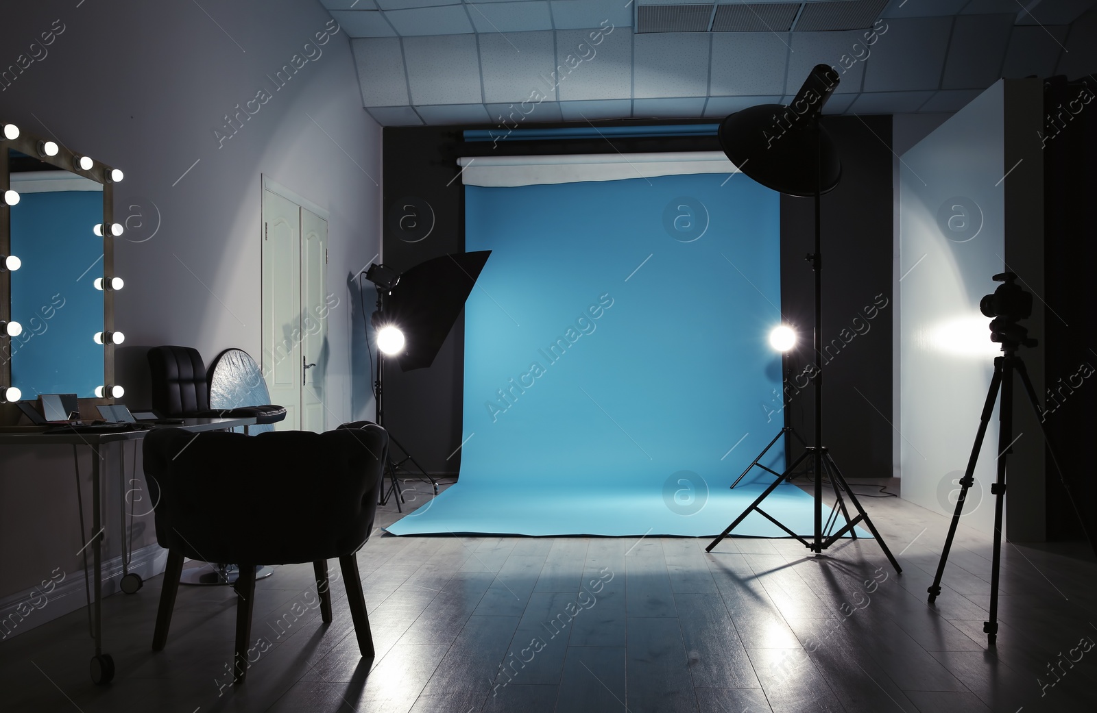 Photo of Modern photo studio interior with professional lighting equipment