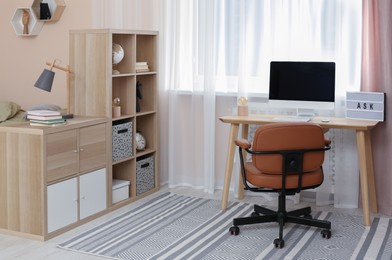 Photo of Modern teenager's room interior with stylish workplace