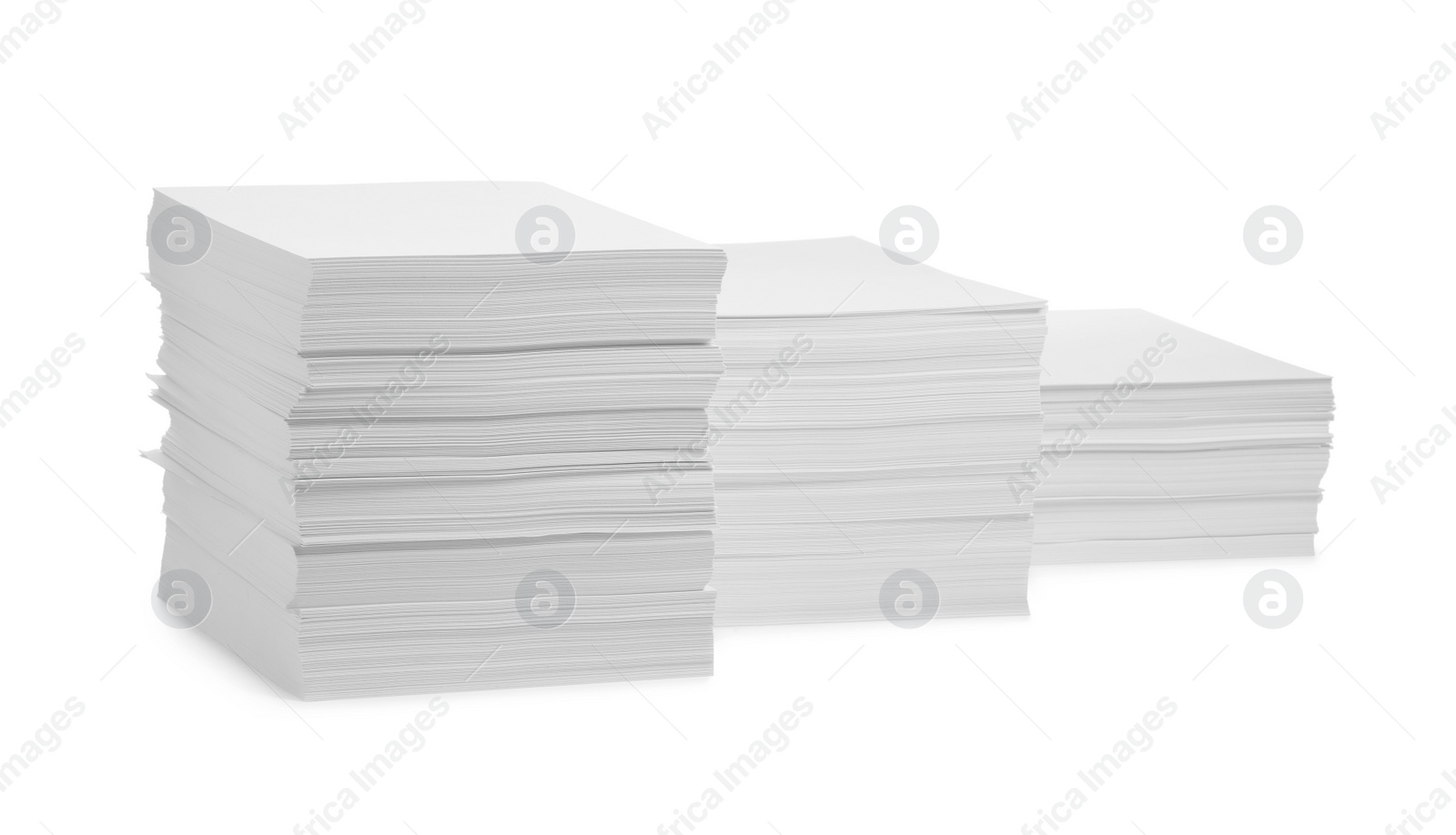 Photo of Stacks of paper sheets on white background