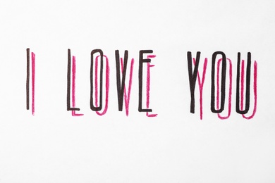 Photo of Handwritten text I Love You on white background