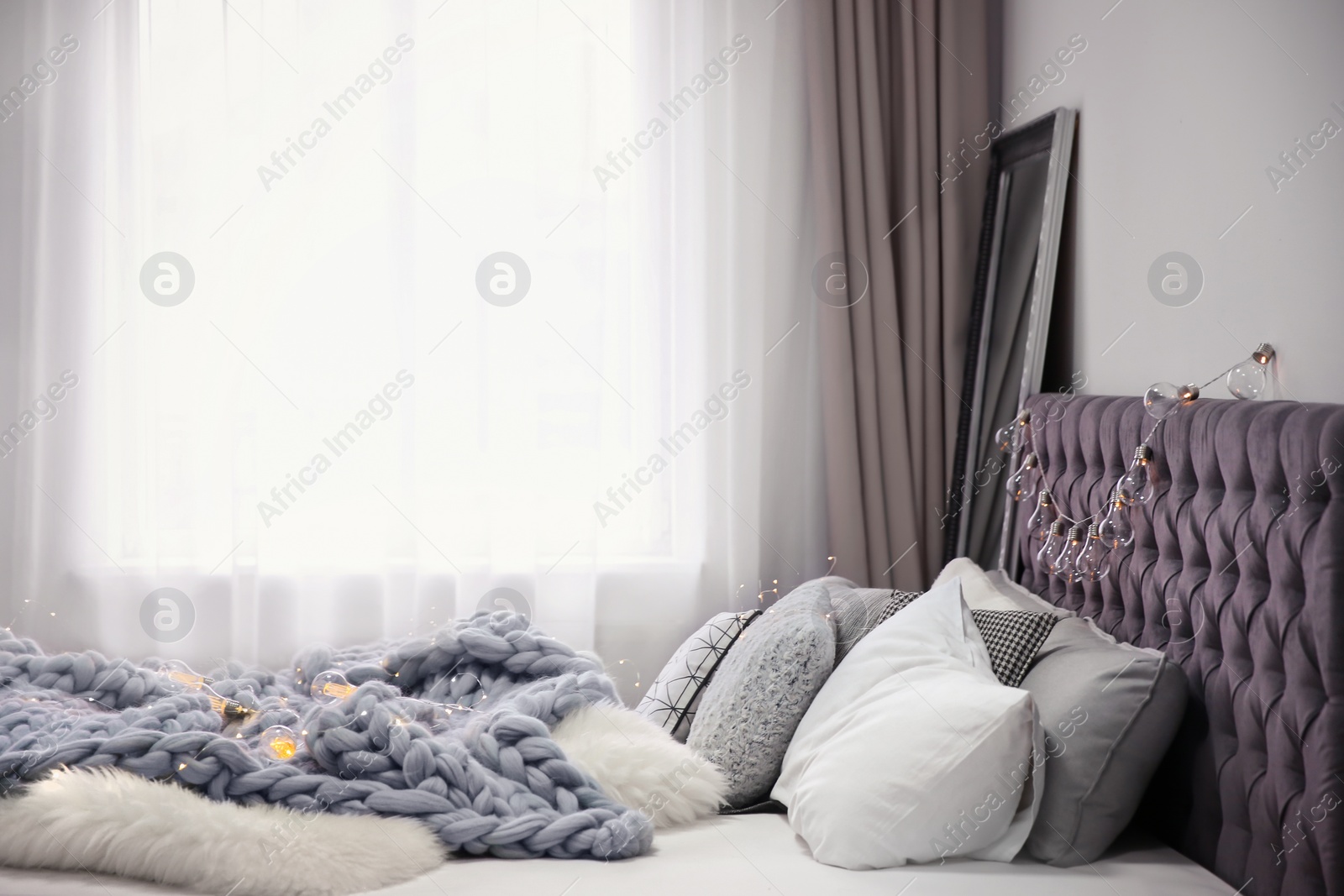 Photo of Cozy room interior with comfortable bed