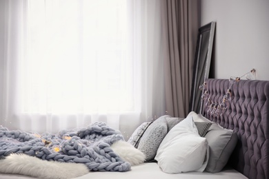 Photo of Cozy room interior with comfortable bed