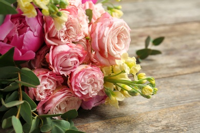 Bouquet of beautiful fragrant flowers on table, closeup