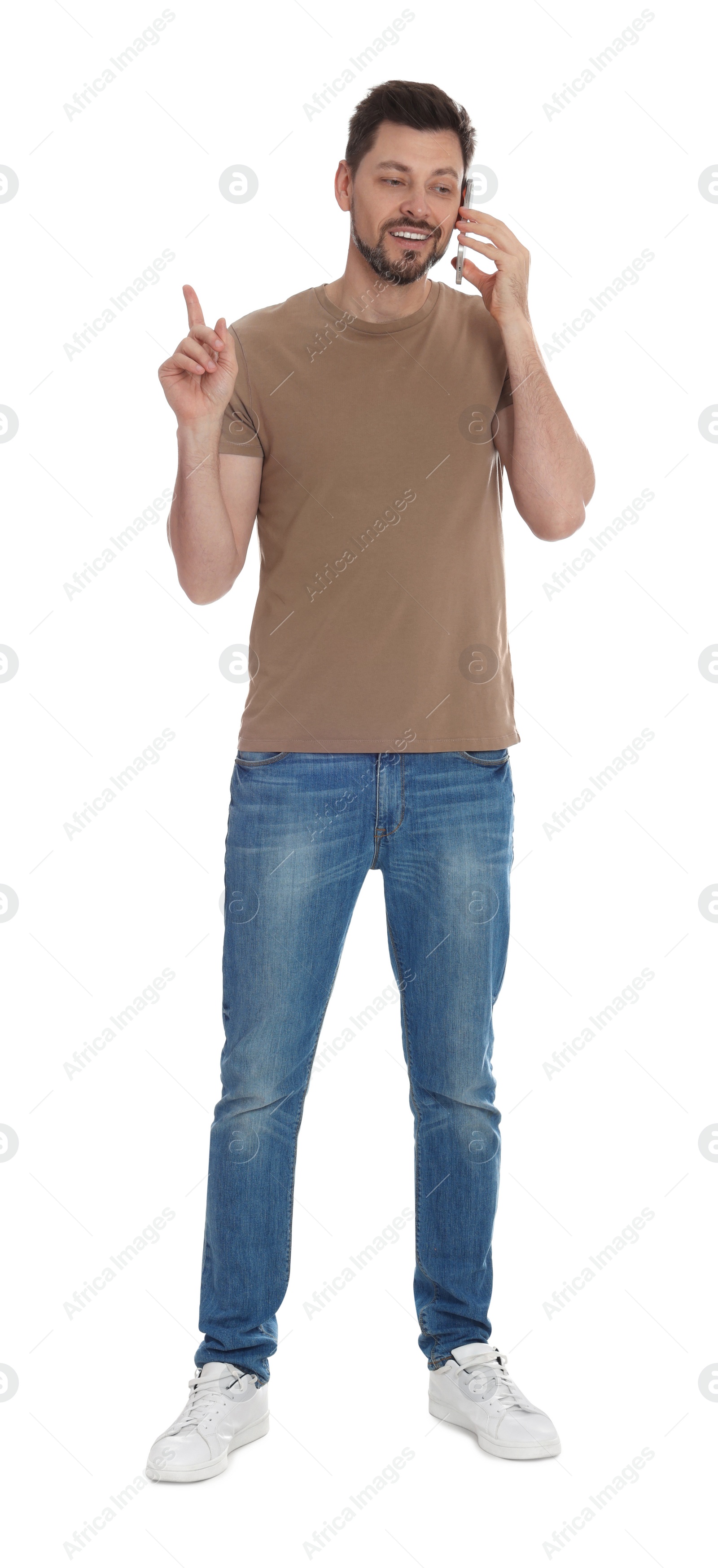 Photo of Man talking on phone against white background