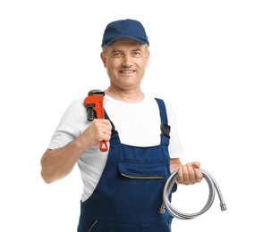 Photo of Mature plumber with pipe wrench and hose on white background