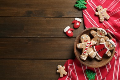 Photo of Delicious Christmas cookies on wooden table, flat lay. Space for text