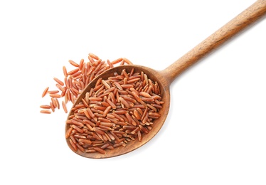 Spoon with uncooked red rice on white background, top view