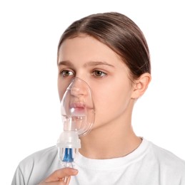 Photo of Cute girl using nebulizer for inhalation on white background