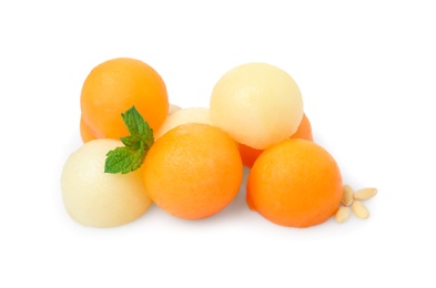Photo of Different melon balls with mint on white background