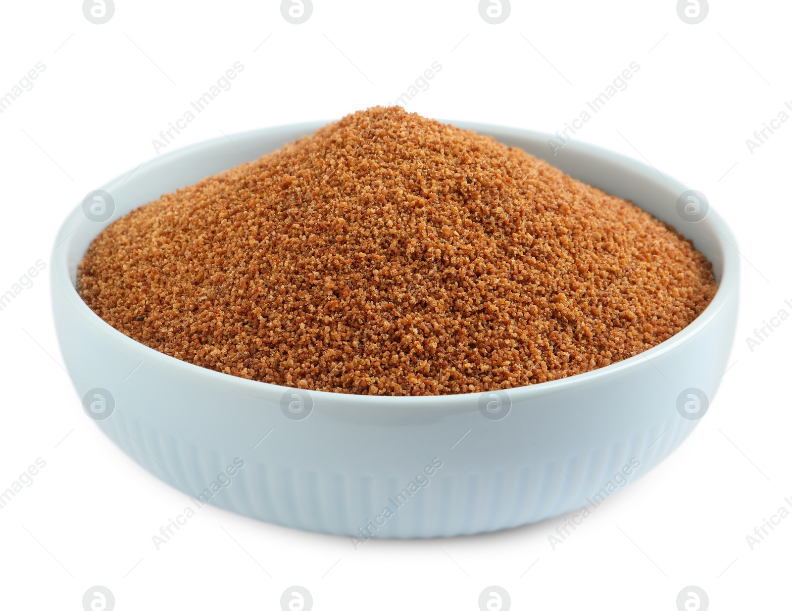 Photo of Natural coconut sugar in bowl isolated on white