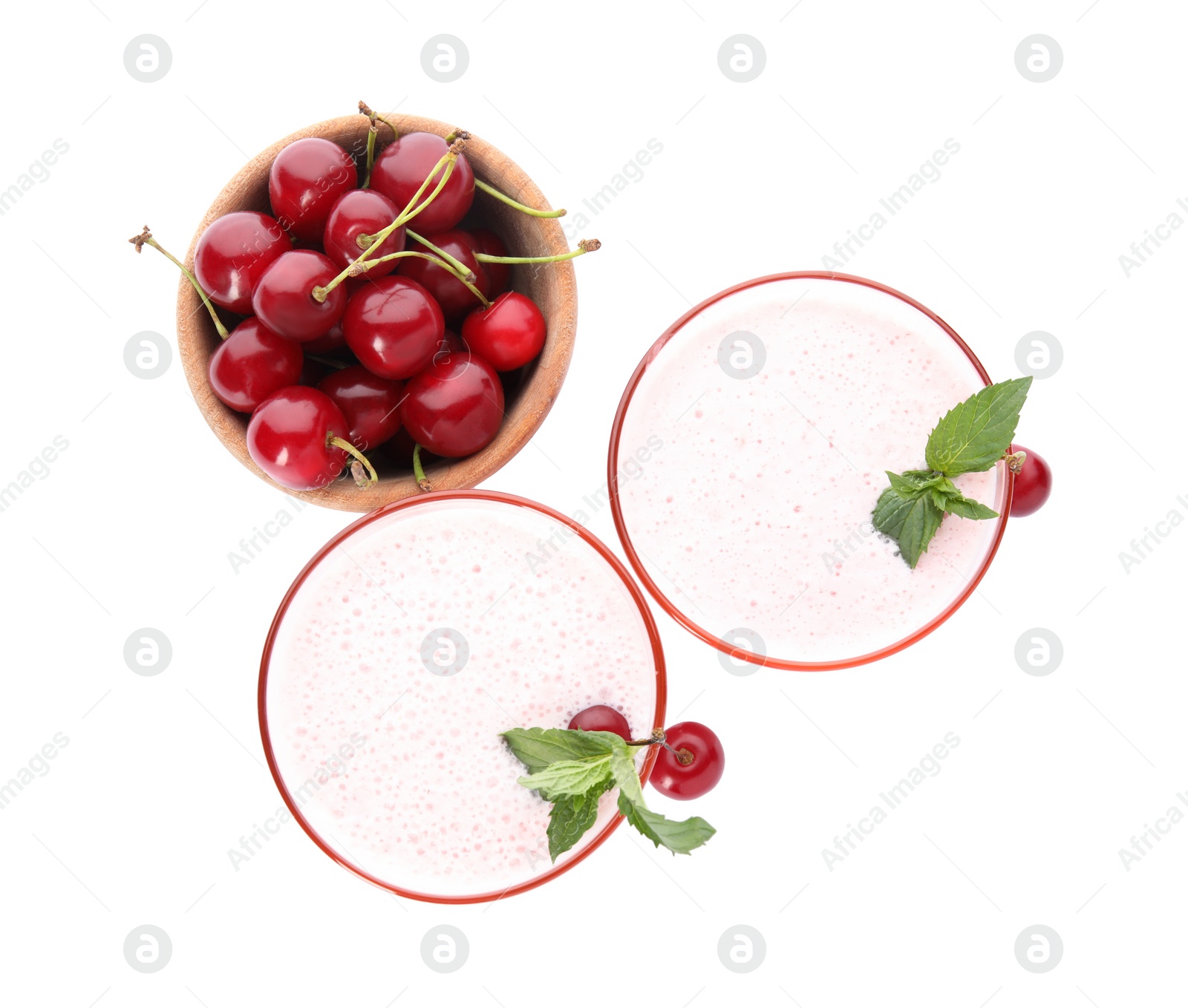 Photo of Tasty fresh milk shakes with cherries on white background, top view