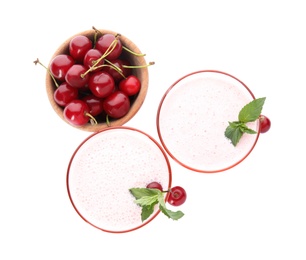 Photo of Tasty fresh milk shakes with cherries on white background, top view