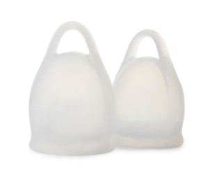 Two silicone menstrual cups on white background