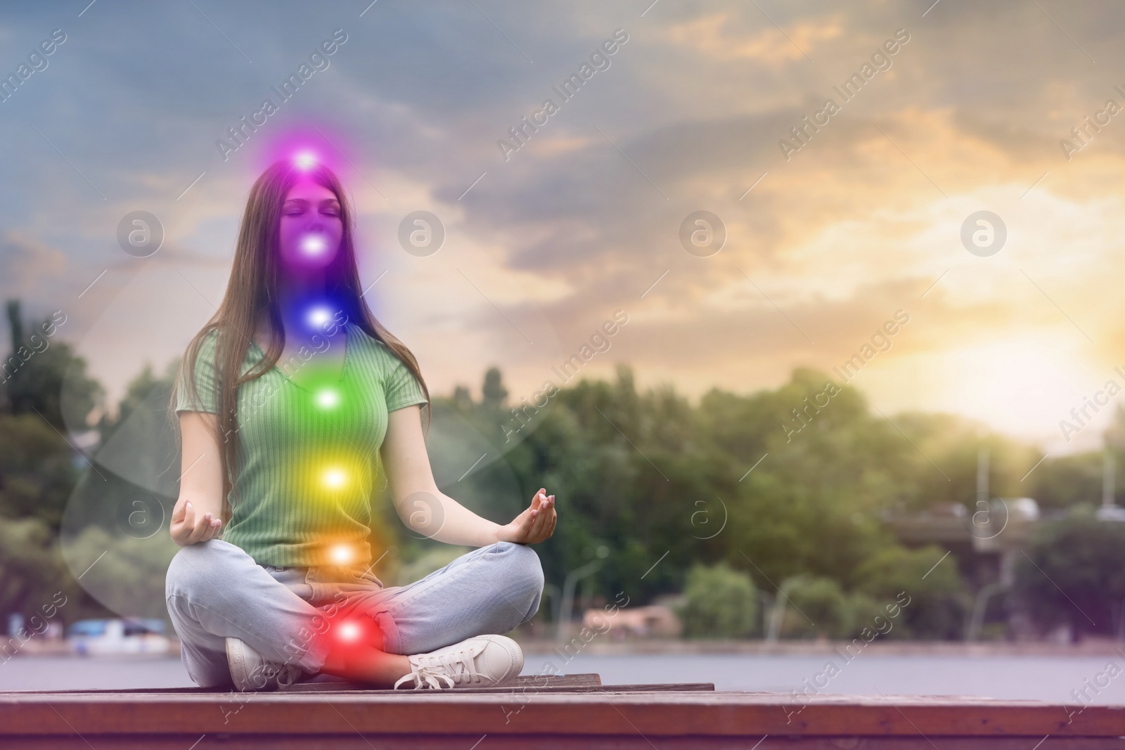 Image of Teenage girl meditating near river. Scheme of seven chakras, illustration