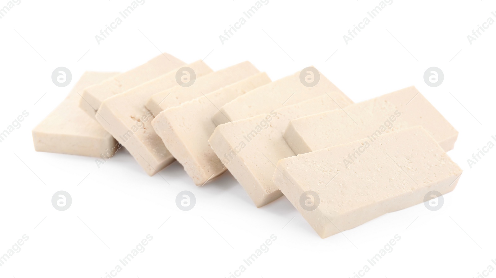 Photo of Slices of delicious raw tofu on white background